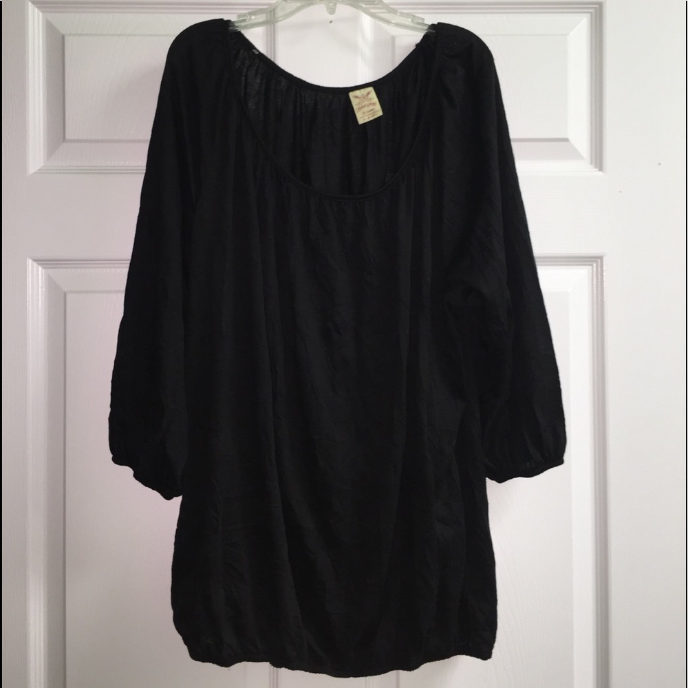 Black blouse with elastic arms and waist.